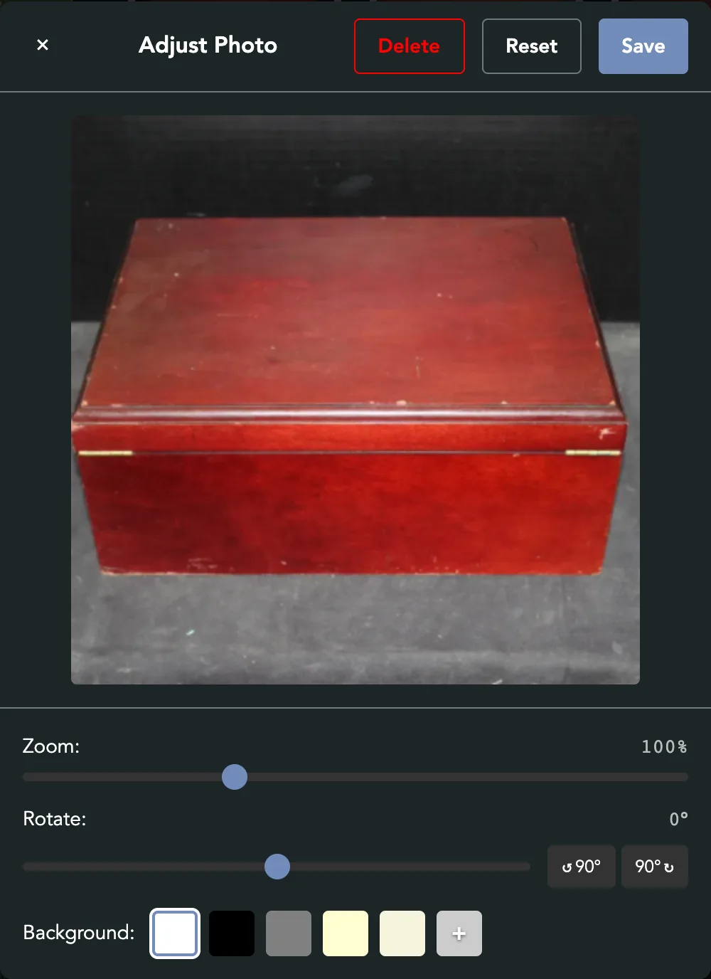 Adjust Photo with Delete, Reset and Save at the top, and Zoom, Rotate and Background under the picture